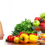 Young healthy woman with fruits and vegetables. Diet.